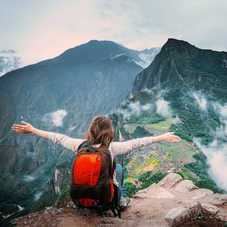 Girl sitting edge rock taking pleasure landscape machu picchu 143092 1714